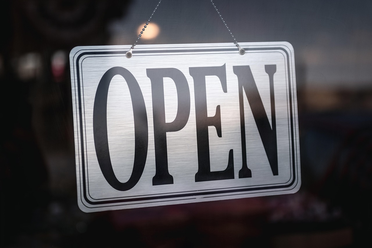 Sign, open sign, signage — Nihar Gala - Driving Innovation and Growth Through Leadership Excellence